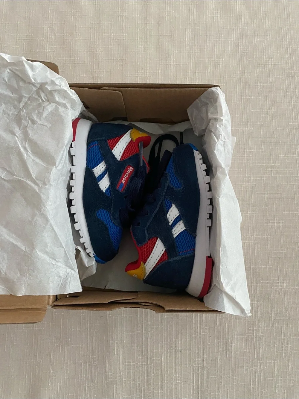 Reebok CL Leather Color Block Sneakers for babies.
